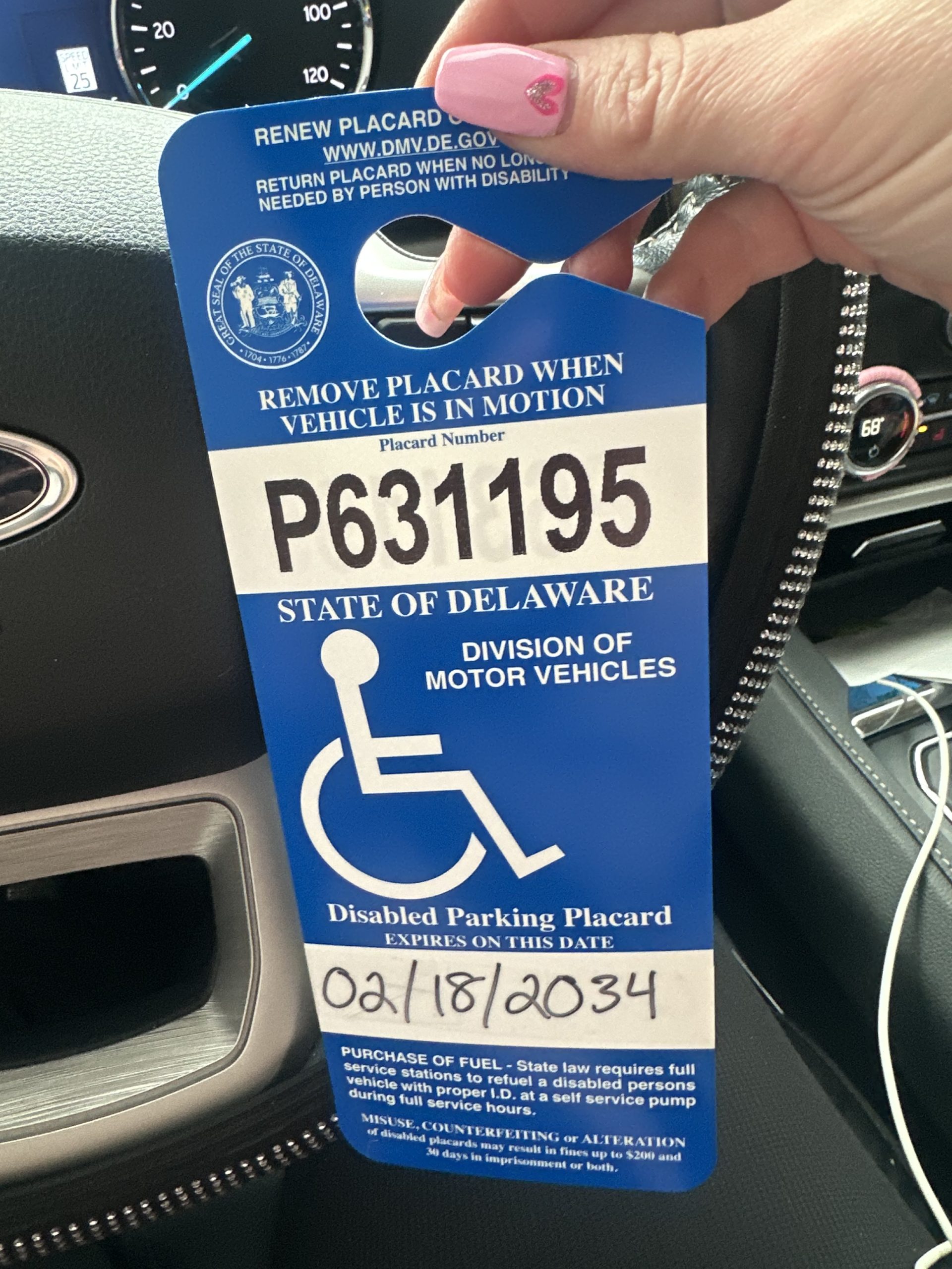 Amanda L. – Delaware with their disability parking placard